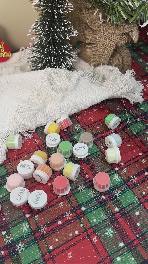 Polar Cheer Collection Christmas ornaments featuring festive designs, including polar bears, penguins, and holiday motifs in vibrant colors, perfect for decorating a Christmas tree.