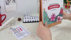 DIY Christmas paint by numbers kit featuring festive countdown calendar design.