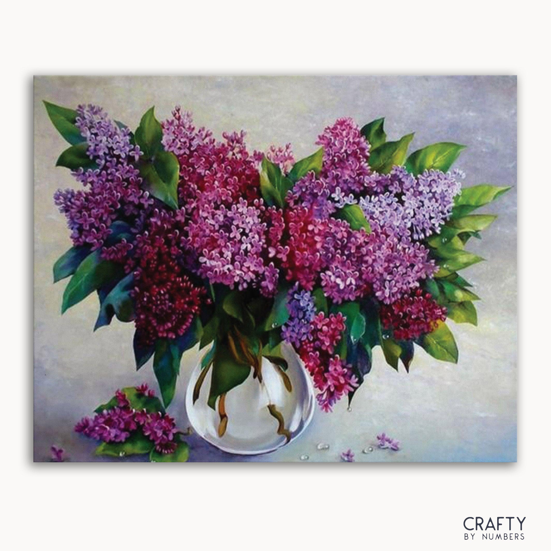 A paint-by-numbers kit image featuring a vase with purple flowers.