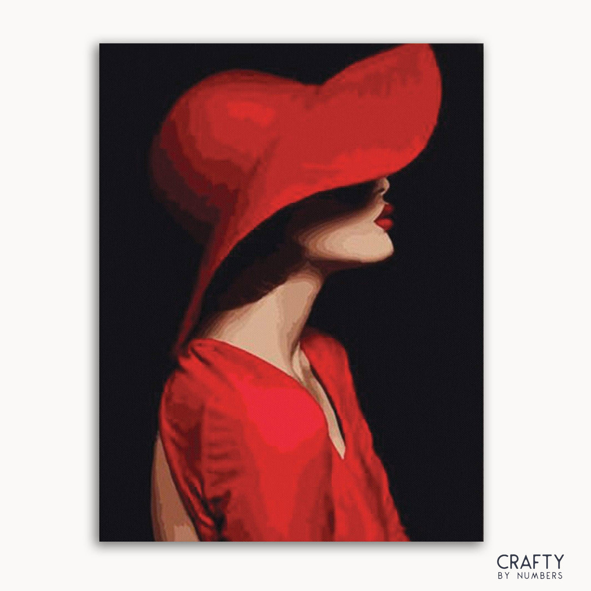 Un kit de peinture par numéros représentant une dame portant un chapeau rouge, avec une palette de couleurs à prédominance rouge et noire.