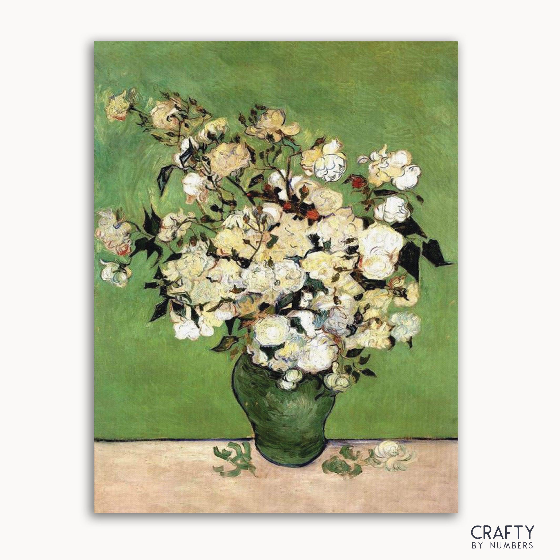 A paint by numbers kit with a pre-painted green background of a vase containing white and pink roses, with the Crafty by Numbers logo in the bottom right corner.