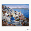 A paint-by-numbers kit depicting a Santorini landscape with white buildings and a blue dome on a canvas, branded by Crafts by Numbers.