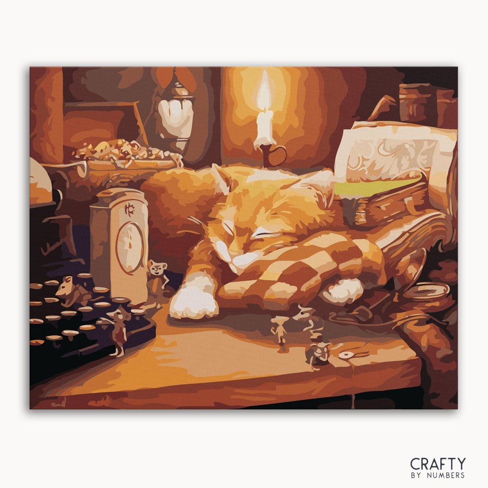 A paint-by-numbers kit image featuring a sleeping cat with a candle lit in the foreground, creating a warm, cozy atmosphere.