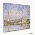 Washington Monument framed by blooming cherry trees in springtime