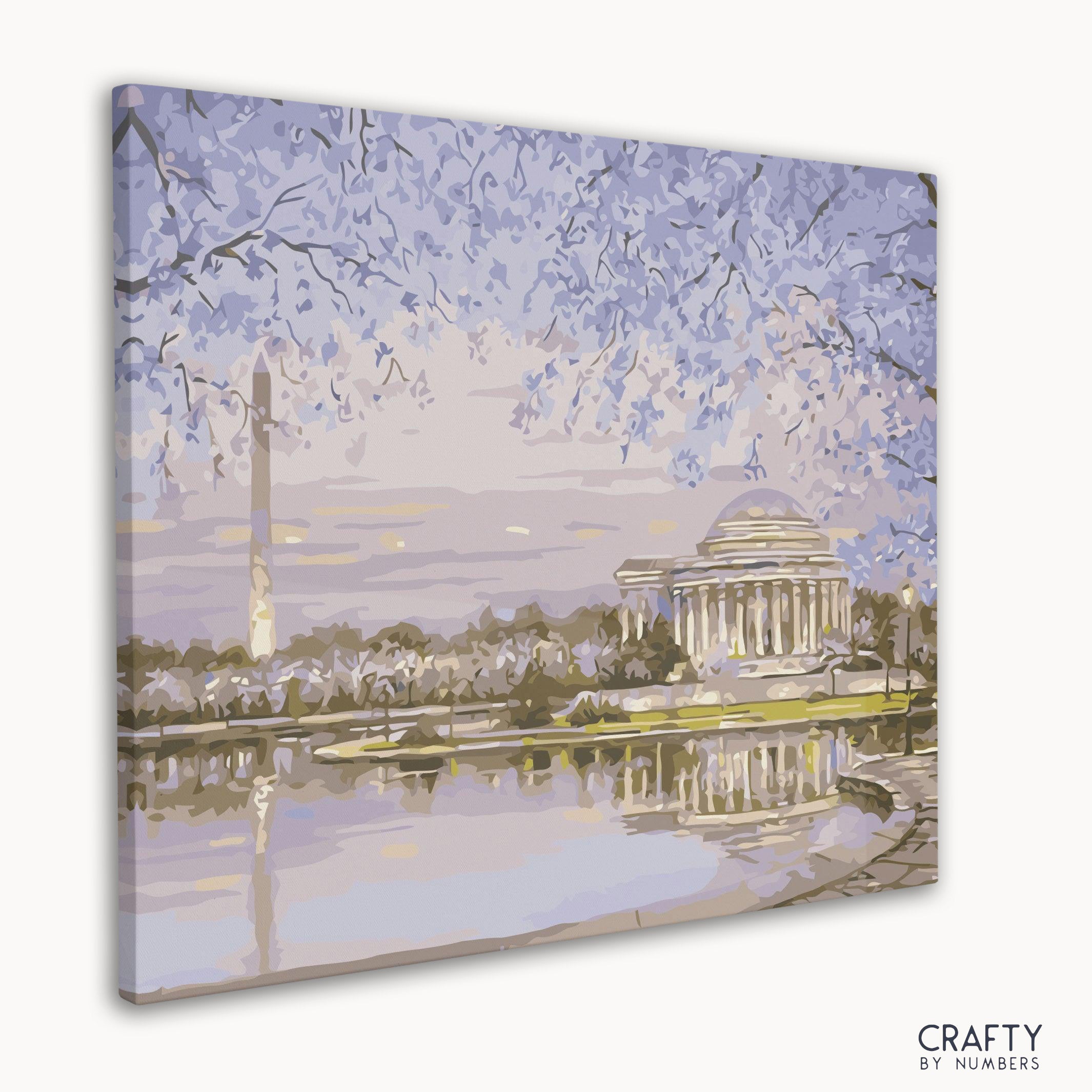 Washington Monument framed by blooming cherry trees in springtime