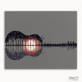 A paint by numbers kit with a silhouette of a guitar filled with a sunset-like design, surrounded by trees and water.