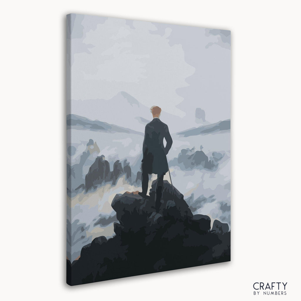 Close-up of paint-by-numbers canvas with foggy mountain and figure outline