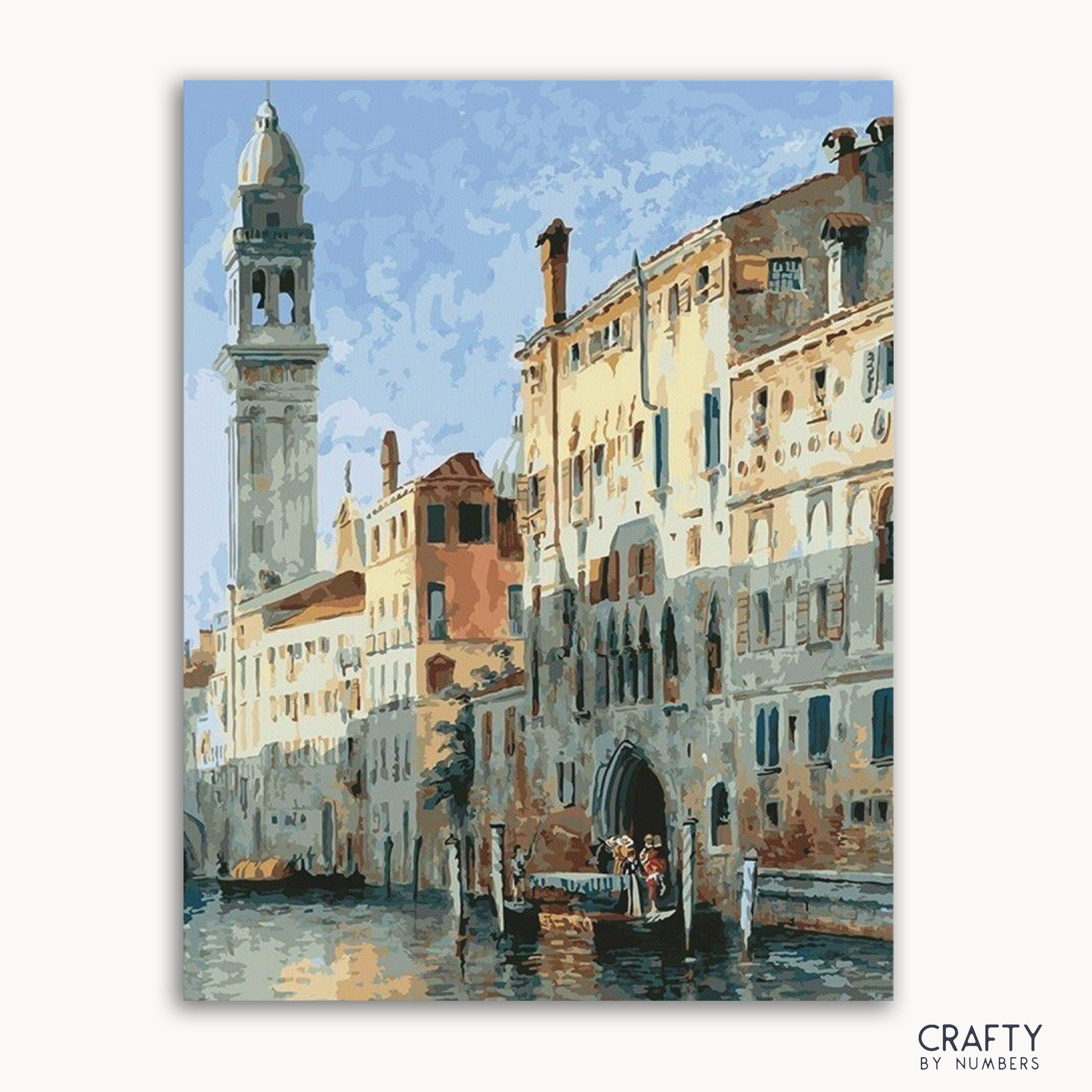 A paint-by-numbers kit depicting a waterside scene in Venice with buildings and a clock tower in the background.
