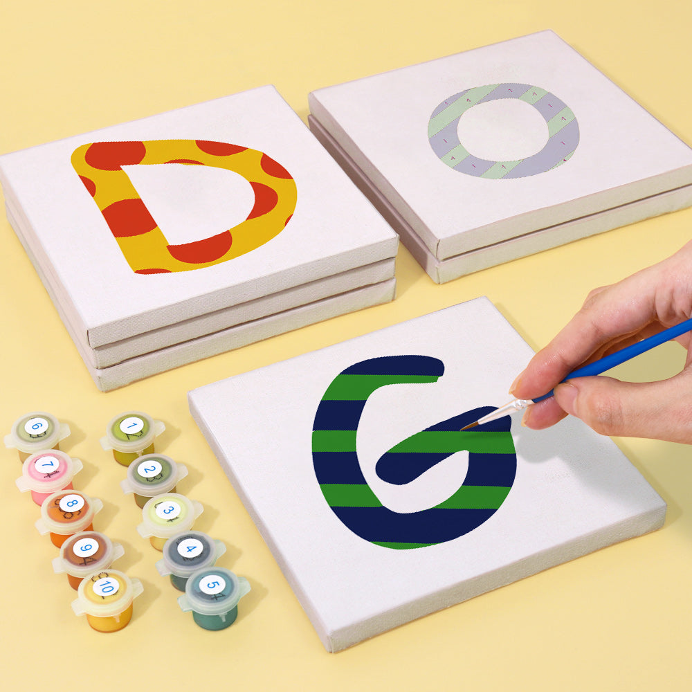 Set of three high-quality detail brushes and numbered paint pots included in the Zigzag Zest Alphabet kit for vibrant and precise painting